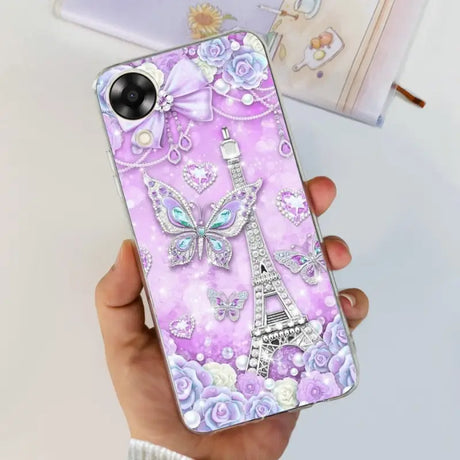 a woman holding a phone case with a purple and white design
