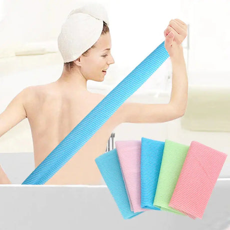 a woman in a bathtub with three towels