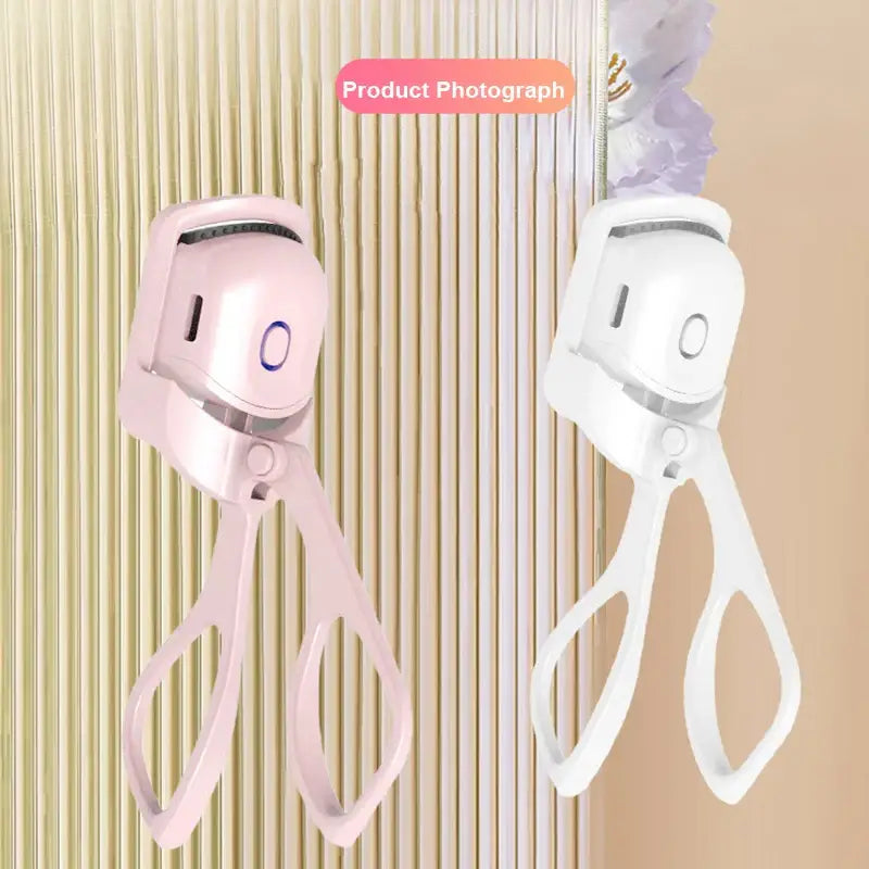 there are two scissors hanging on a wall next to a toothbrush