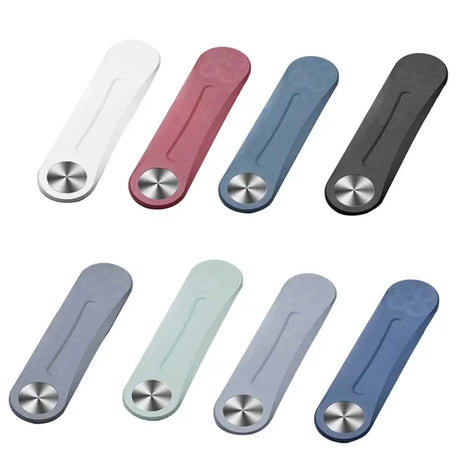 a set of four different colored plastic bottle openers