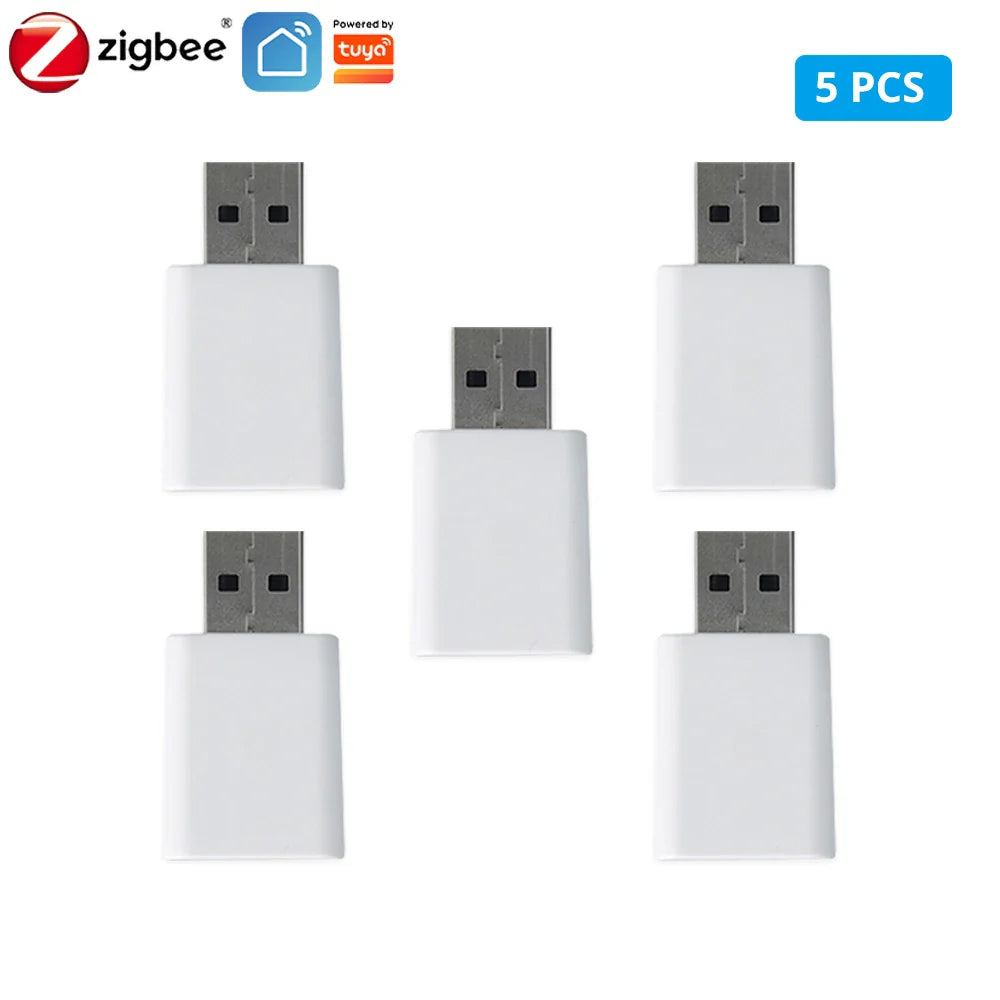 Five white USB Zigbee dongles.