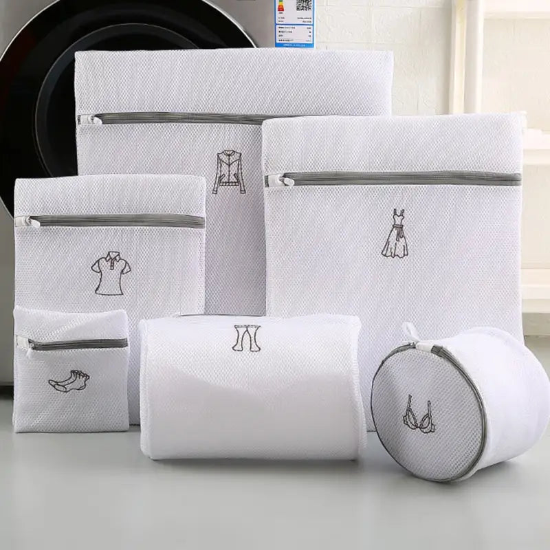 a set of white towels and a wash bag