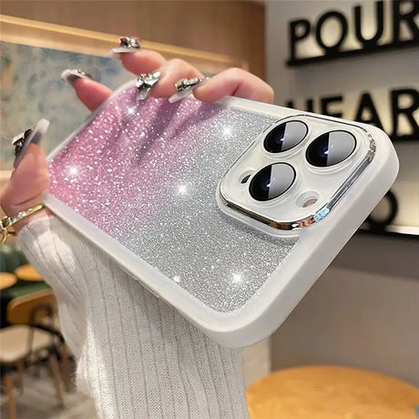 a woman holding a phone case with glitter