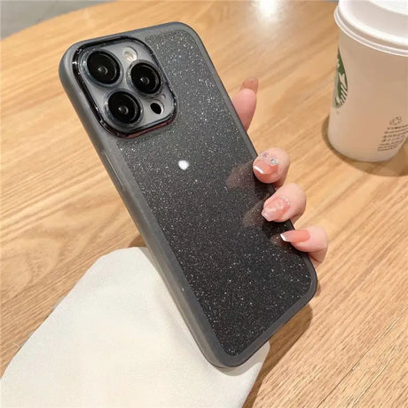 a woman holding a phone case with glitter on it