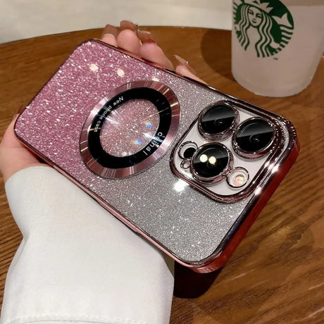 a person holding a pink glitter phone case