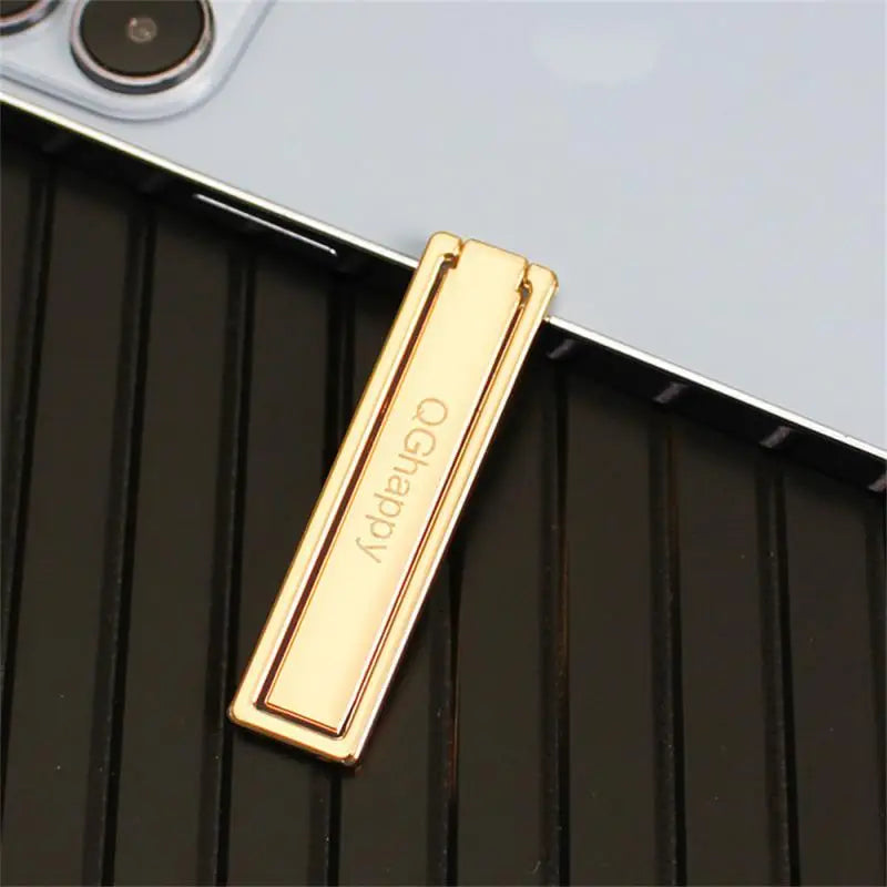 a gold metal case with a metal bar on it