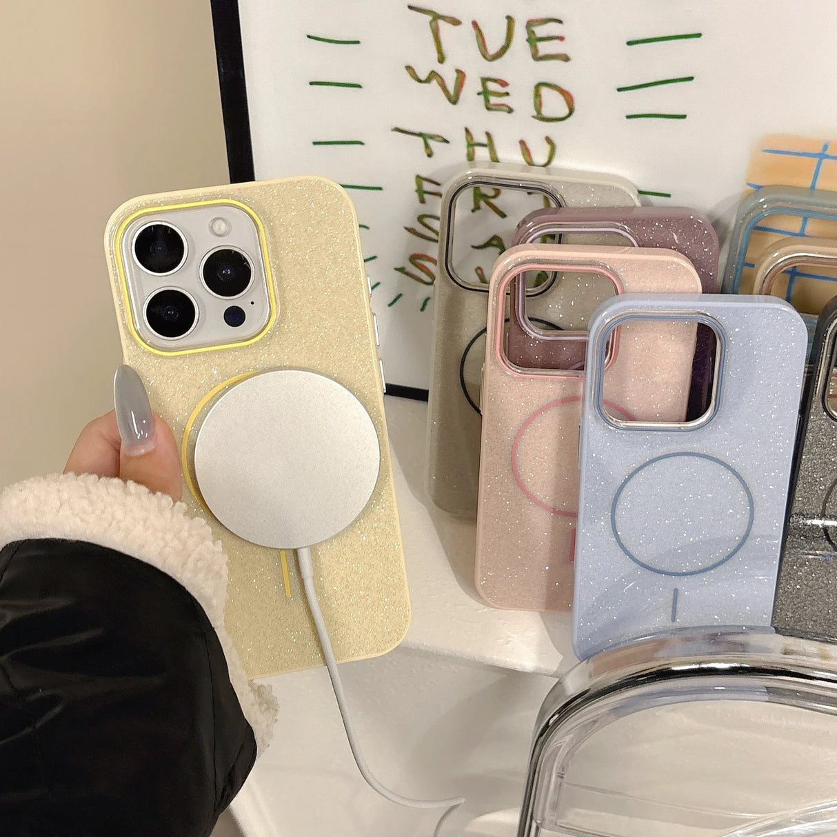 Gold glitter slim phone case for iphone with built-in circular wireless charging pad shown from the back side