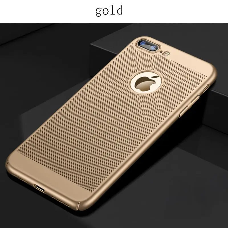 a gold iphone case with a holed design on the back