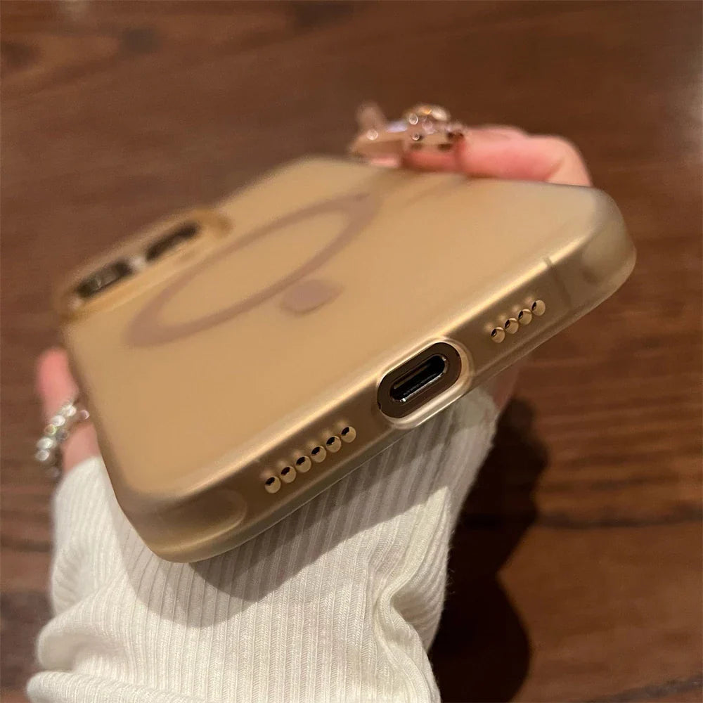 Gold iPhone in a clear case.