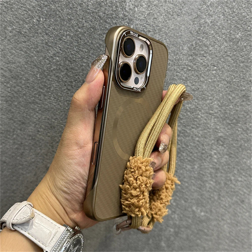 Gold phone case with fluffy wrist strap.