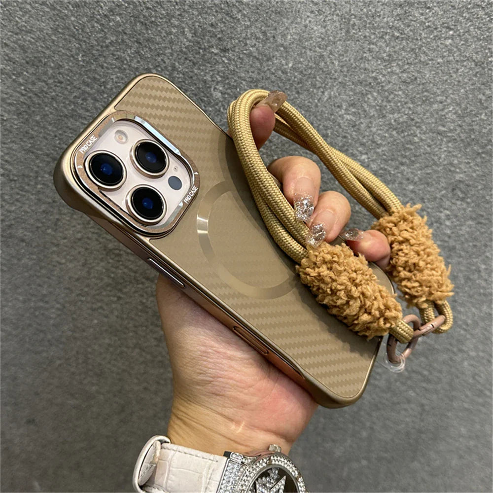 Gold-toned phone case with lanyard.