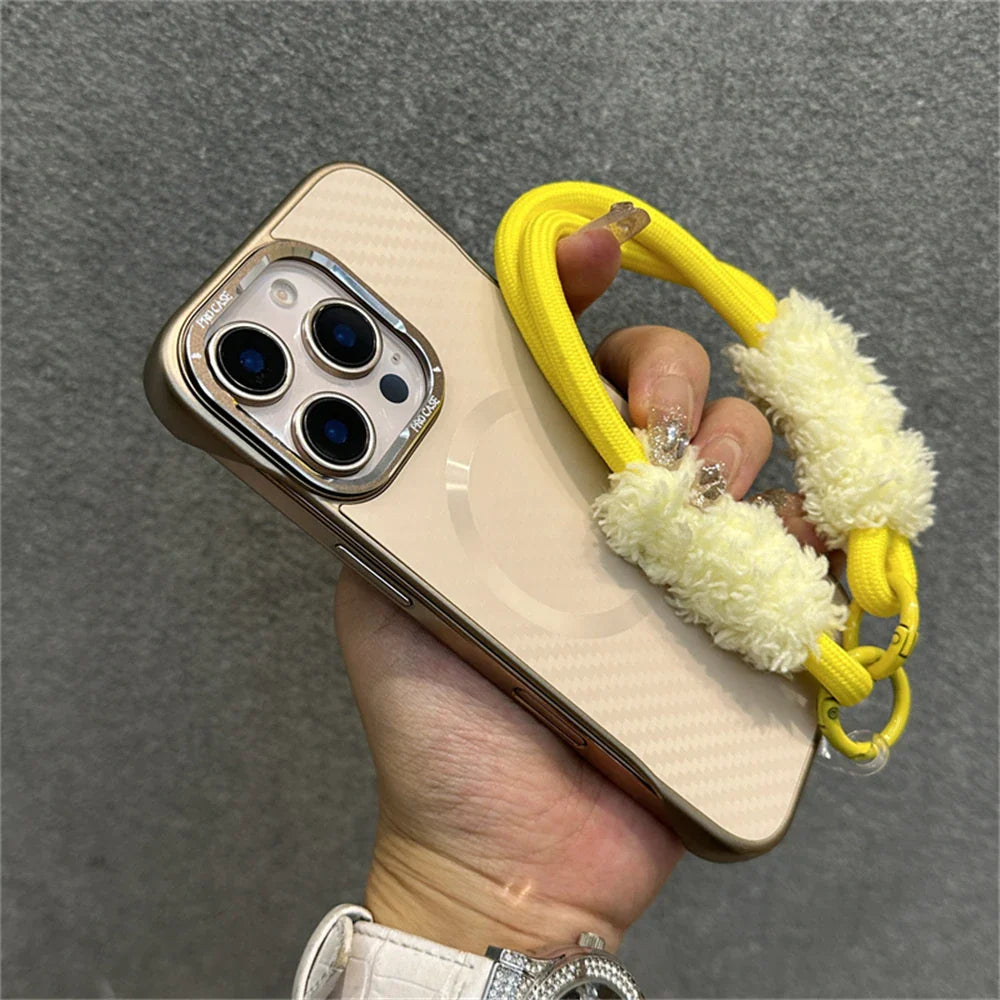 Gold-trimmed phone case with yellow chain and fuzzy accents.
