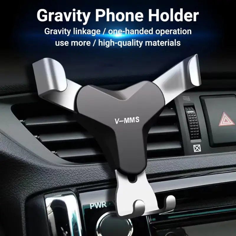 a close up of a car dashboard with a cell phone holder