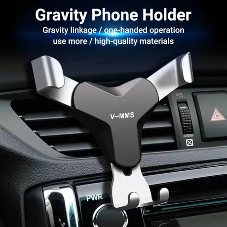 a close up of a car dashboard with a cell phone holder