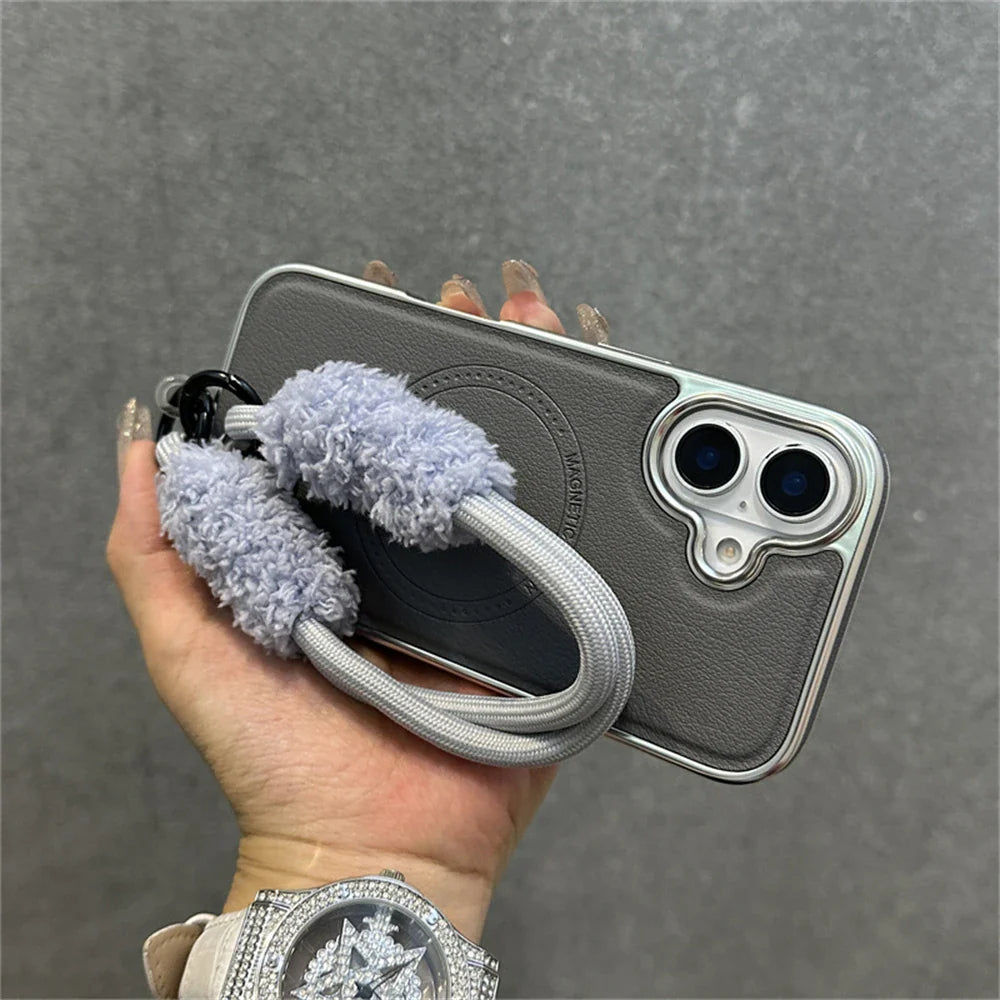 Gray phone case with fluffy strap.