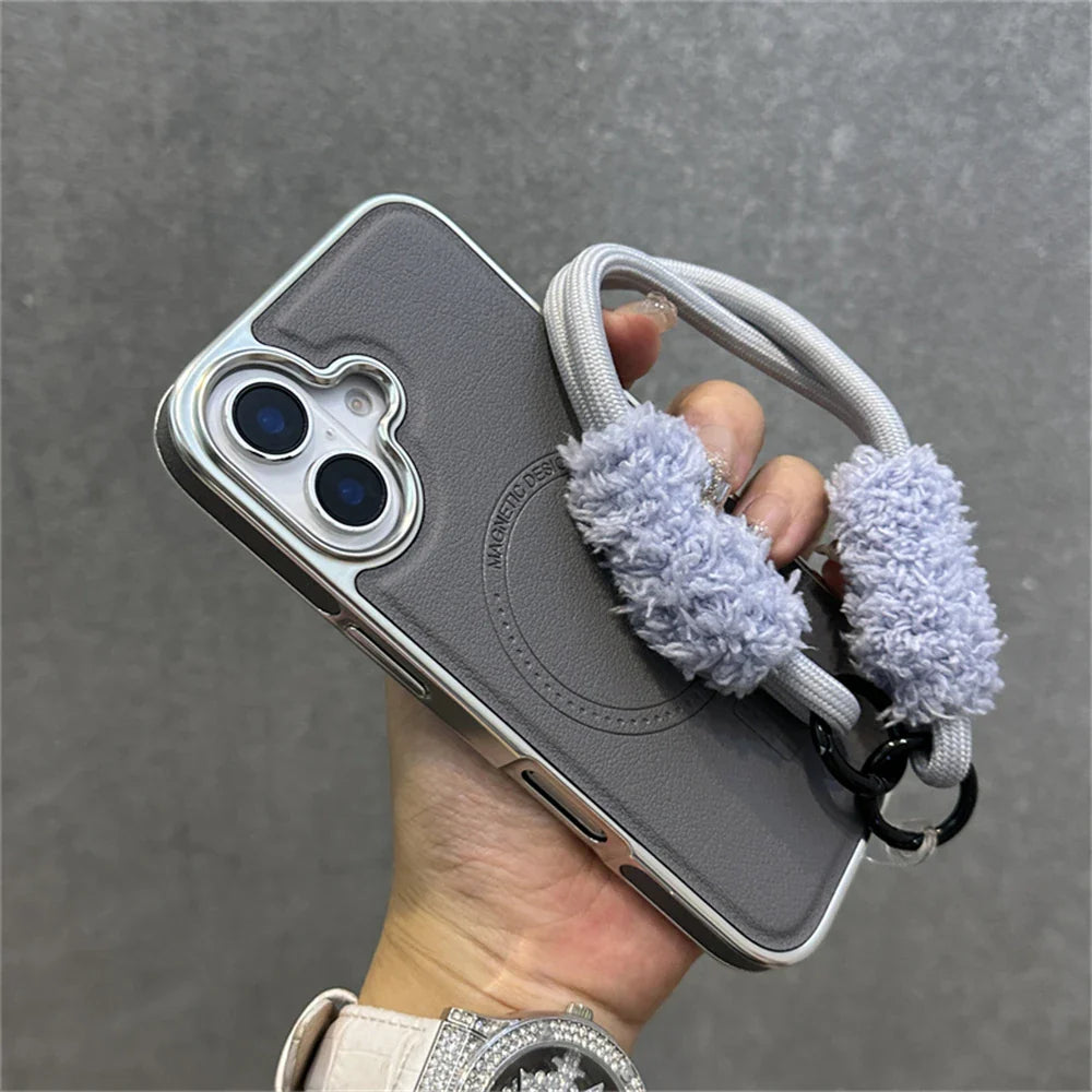 Gray phone case with fluffy strap.