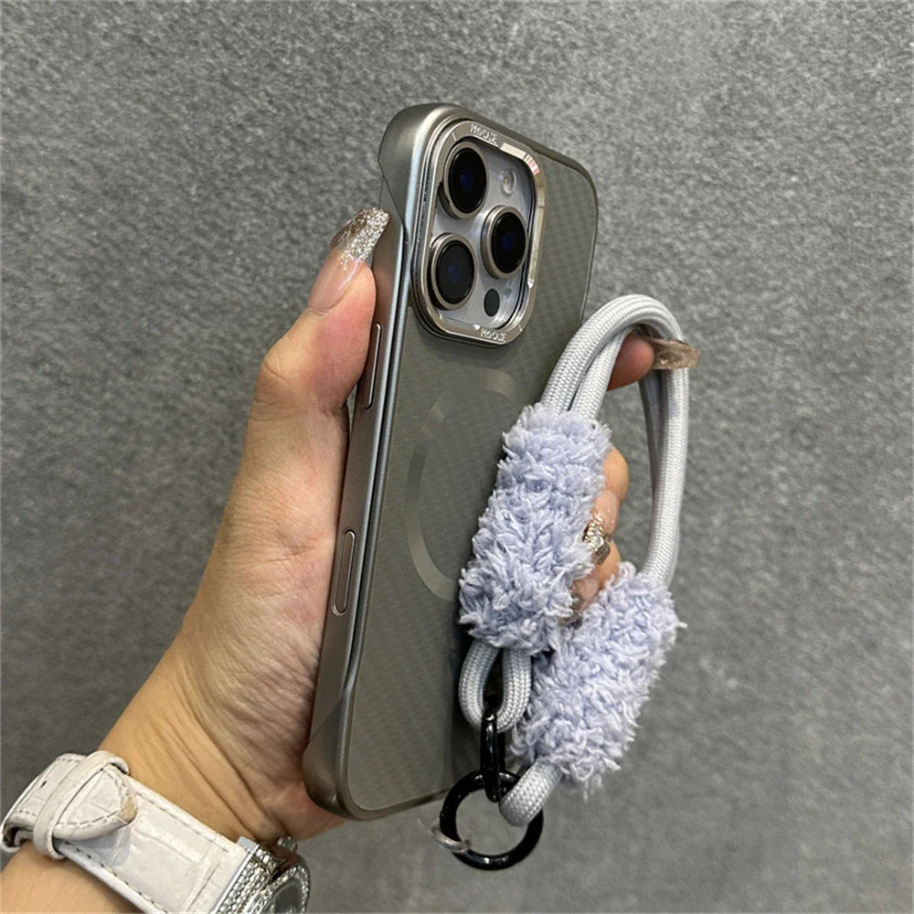 Gray phone case with fluffy wrist strap.
