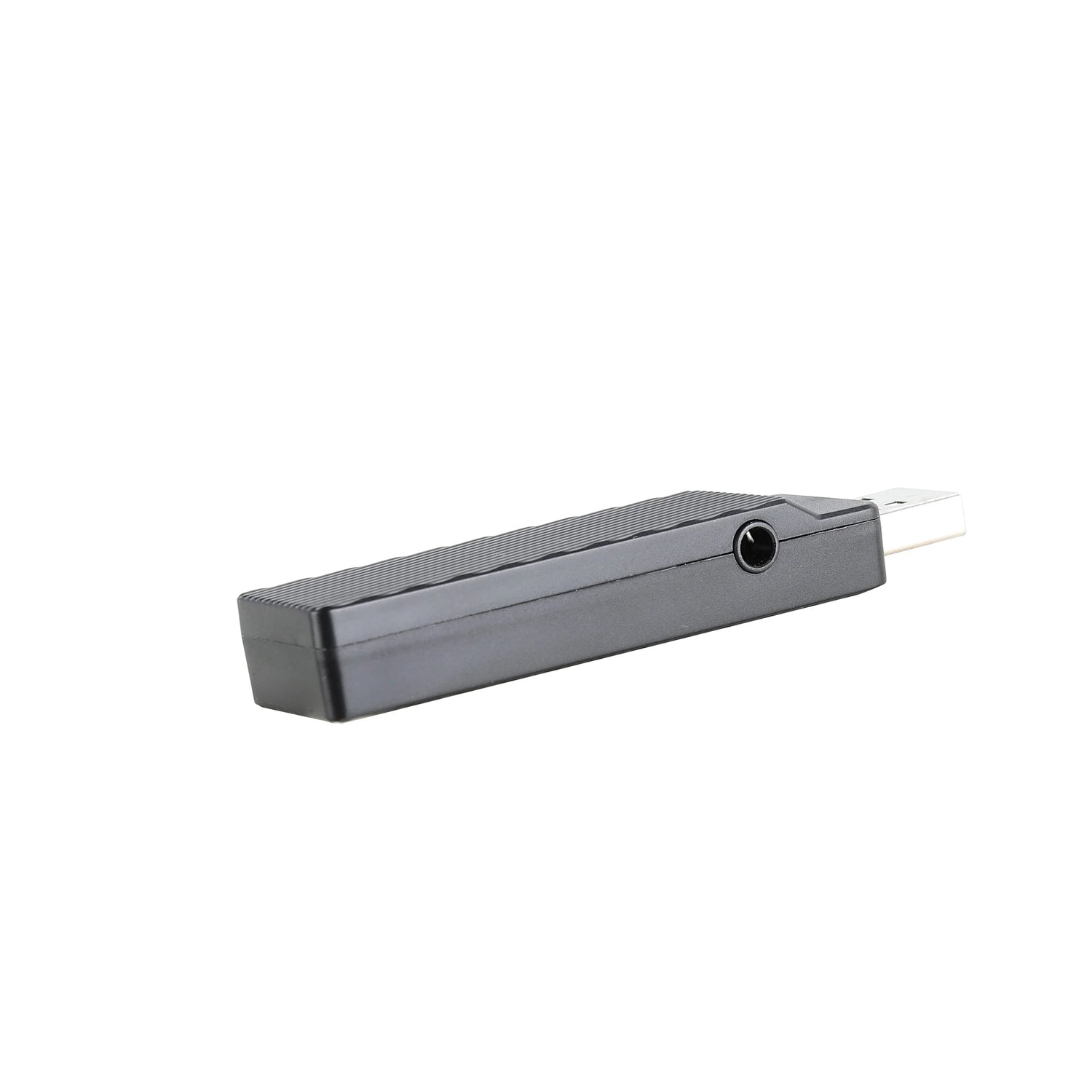 Gray rectangular electronic device with a small circular opening on one end and a thin cable attached.