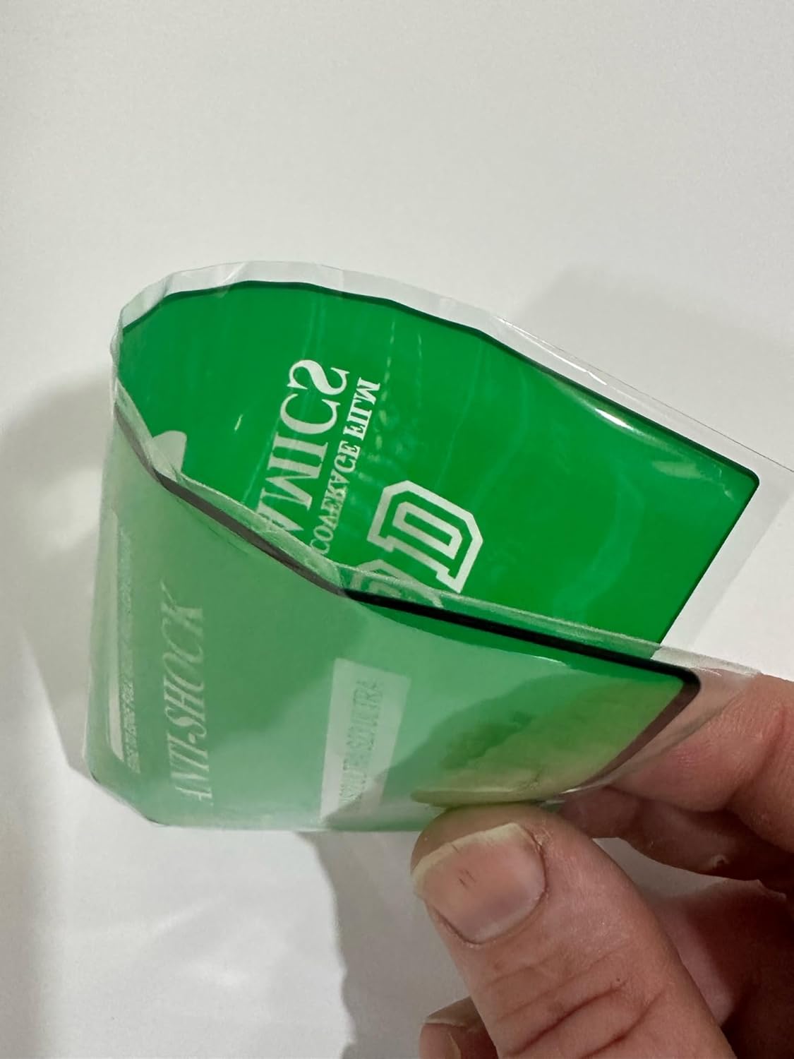 Green anti-shock phone screen protector.