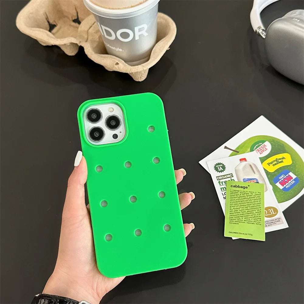 Green iPhone case with holes.