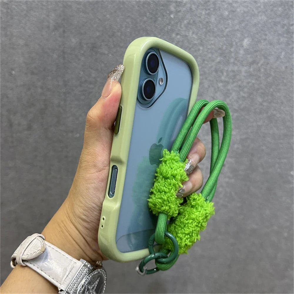 Green phone case with fuzzy strap.