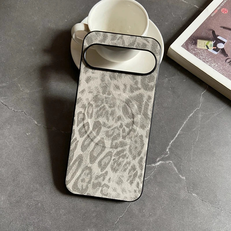 A grey and white leopard print phone case with a black border.
