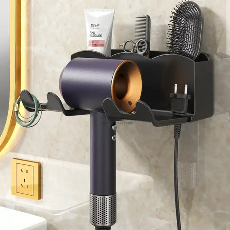 a hair dryer and comb are on the wall