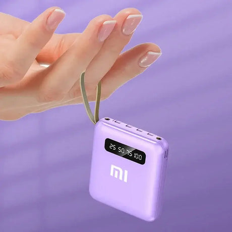 a hand holding a purple cell phone