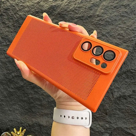 a hand holding an orange case with a pair of sunglasses