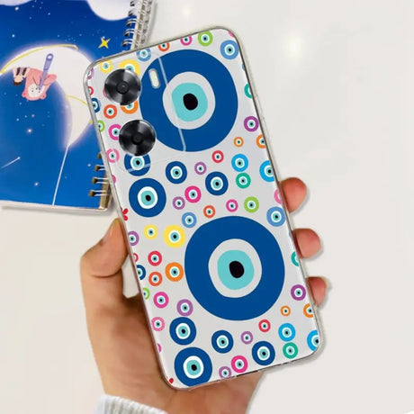 a hand holding a phone case with a pattern on it