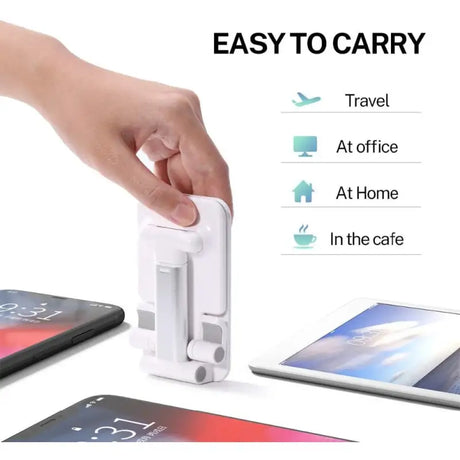 a hand is holding a phone and a tablet
