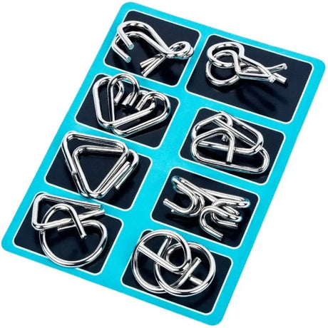 a set of silver metal rings on a blue tray