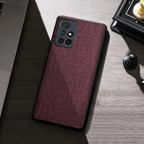 the back of a red iphone case on a desk