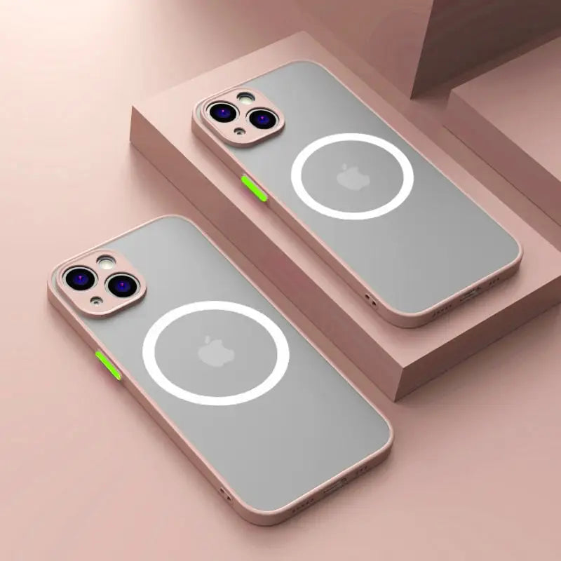 two iphone cases with a green button on them