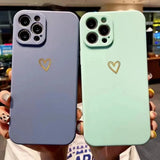 two iphone cases with heart stickers