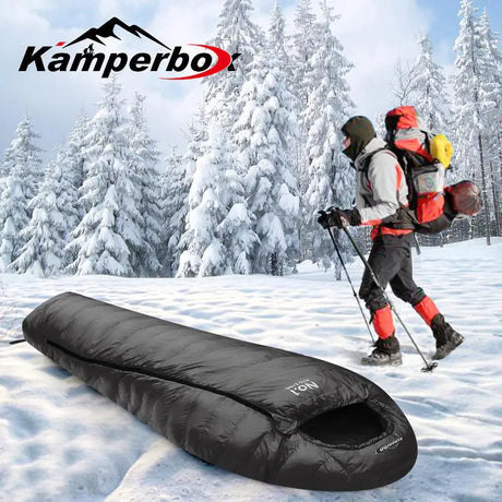 a man walking in the snow with a sleeping bag