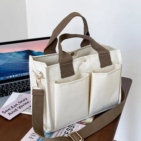 a laptop and a bag on a desk