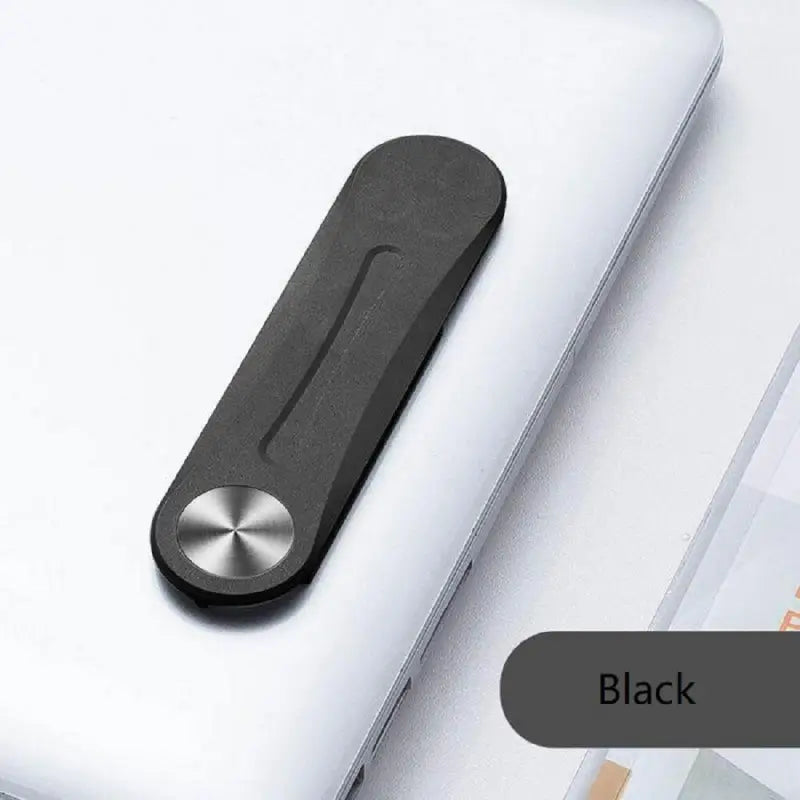 a laptop with a black handle on top of it