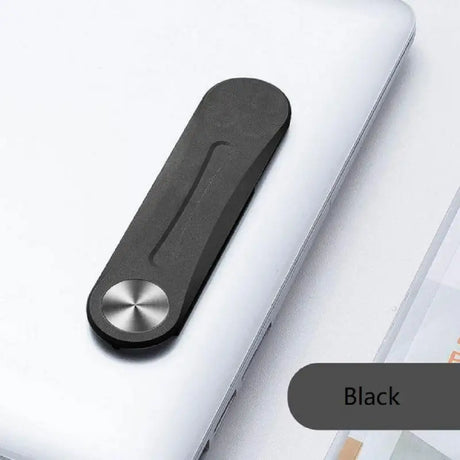 a laptop with a black handle on top of it