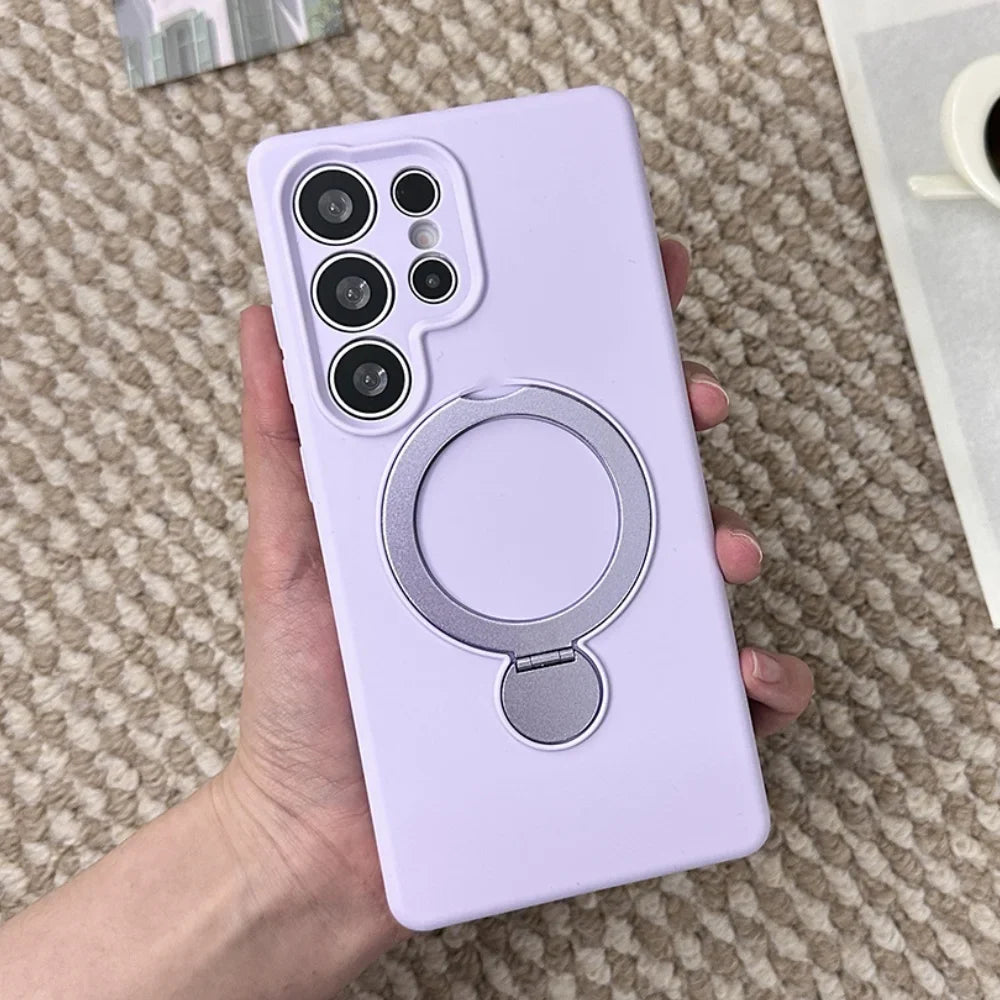A lavender phone case with a silver ring holder.