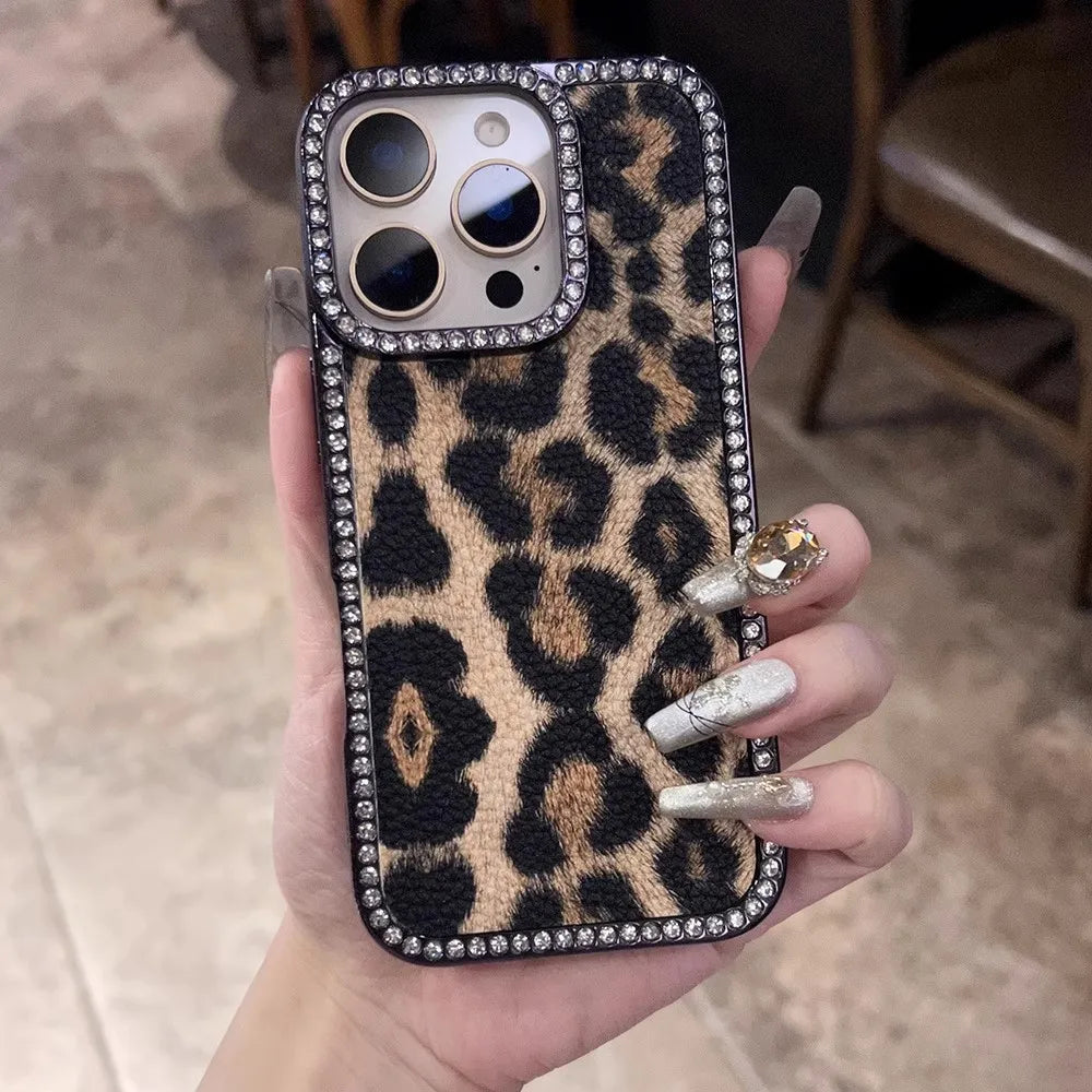 Leopard print phone case adorned with rhinestones.