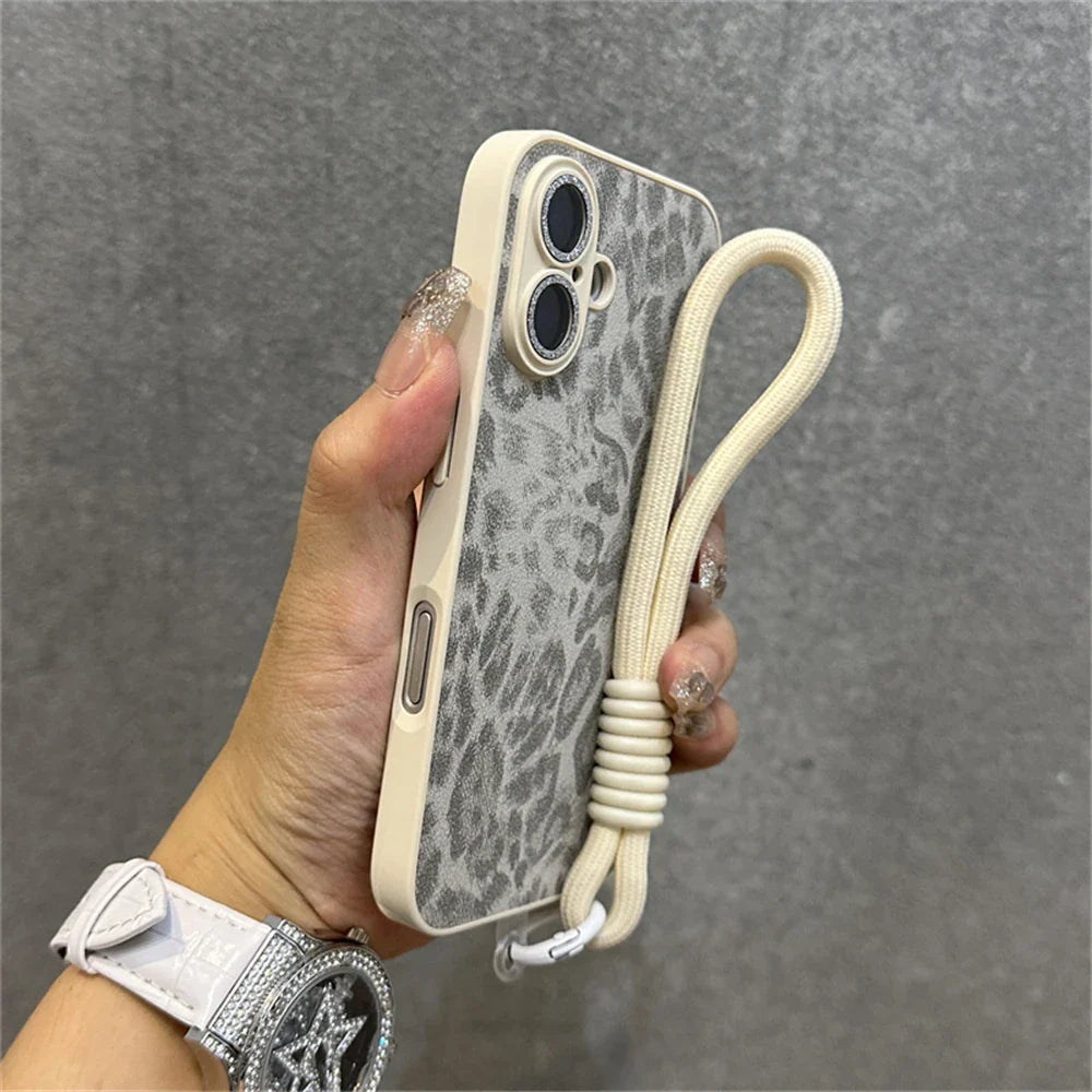 Leopard-print phone case with wrist strap.