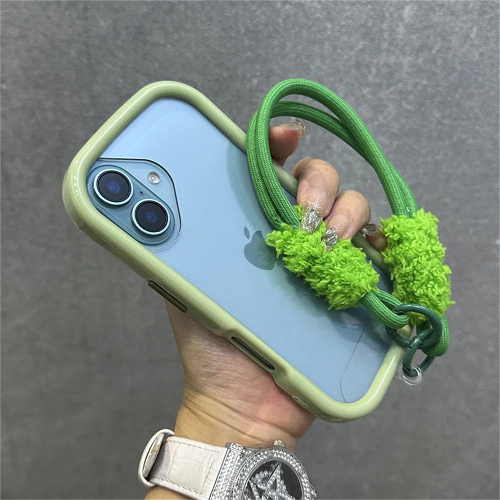 Light blue iPhone in a green case with a green rope strap.