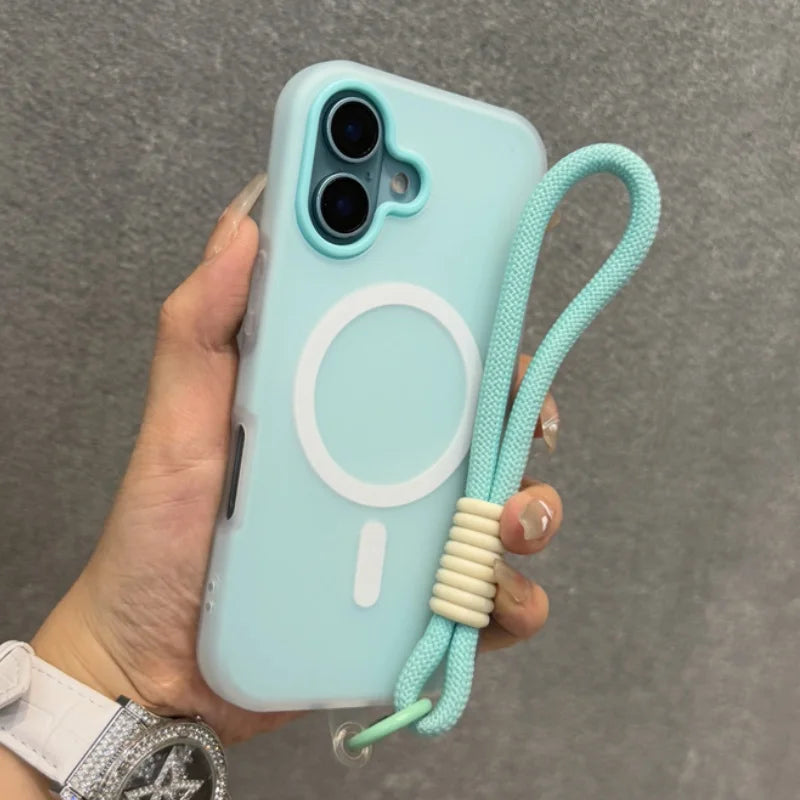 Light blue silicone phone case with a Magsafe ring and an attached mint green wrist strap.