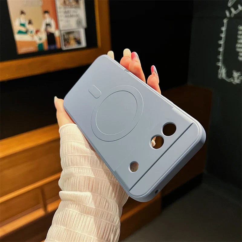 Light blue smartphone case with a cute face design featuring circular eyes and a small mouth.