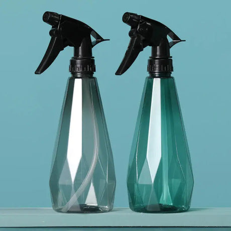 two bottles of spray on a blue background