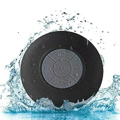 the waterproof bluetooth speaker is shown in the water
