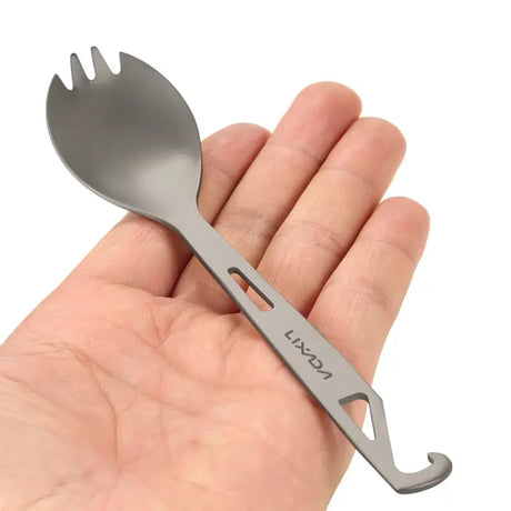 a hand holding a fork with a fork in it