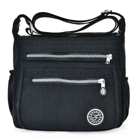 the black nylon bag with zippers and a zipper closure
