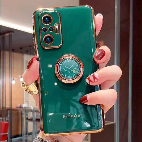 a woman holding a green phone case with a gold ring